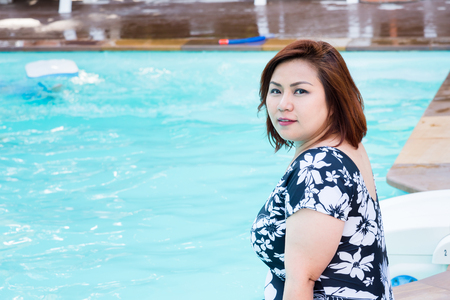 Rayong, Thailand - April, 28, 2017 : Unidentified name Beautiful fat woman sitting in the swimming pool of Vongdeuan Resort at the Koh Samet Island, Rayong, Thailandのeditorial素材
