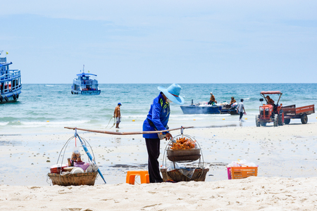 Rayong, Thailand - April, 29, 2017 : Unidentified name Woman Selling Somtum Grilled Chicken, Local Food on the Samet Island Beach, Rayong, Thailandのeditorial素材