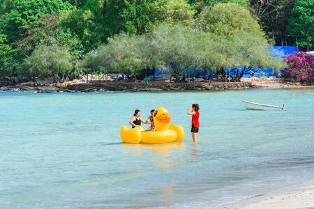 Rayong, Thailand - April, 28, 2017 : Unidentified name Tourists are playing in the sea with Inflatable yellow duck swim tube at the Koh Samet island, Rayong, Thailandのeditorial素材