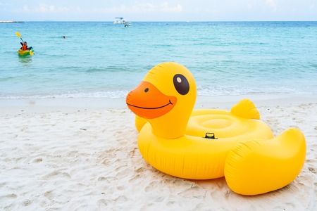 Rayong, Thailand - April, 28, 2017 : Yellow Duck swim tube on the beach Inflatable duck.Fantasy Swim Ring for Summer sea Trip on the beach at the Koh Samet island, Rayong, Thailandのeditorial素材