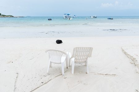 Rayong, Thailand - April, 28, 2017 : White beach chair. sunbath beach chair. plastic beach chair on the beach at the Koh Samet island, Rayong, Thailandのeditorial素材