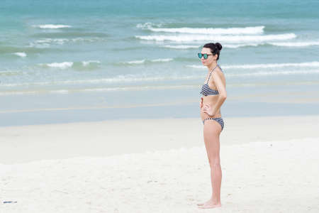 Trat, Thailand - May, 20, 2017 : Unidentified name woman wear a swimsuit bikini standing on the Prao Beach in Koh Chang island Trat, Thailand.のeditorial素材