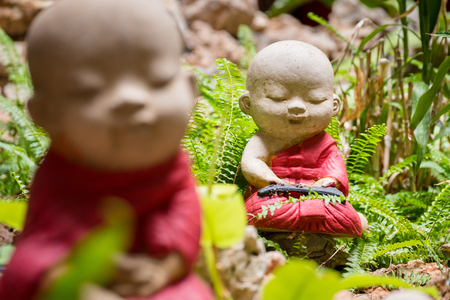 Closeup the Beautiful small statue of a novice in Wat Borom Raja Kanjanapisek Wat Leng Nei Yee 2 Temple, People go to temple to pray for good luck and success in life.のeditorial素材
