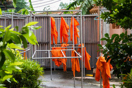 Buddhist monk traditional clothes yellow robe get dryの写真素材
