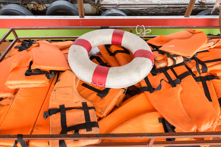 Lifebuoy and Life jacket on the ferry to Koh Kret, Thailandの写真素材