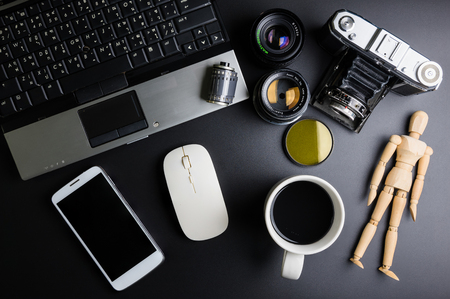 Nonthaburi, Thailand - June, 28, 2017 : Top view of office stuff photographer with equipment analog ancient film camera, Laptop and wireless mouse.Concept analog photographer workplace.のeditorial素材