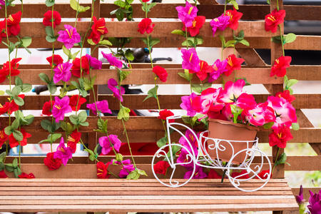 Plastic flower in pot white bicycleの写真素材