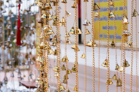 Chaiyaphum, Thailand - July, 02, 2017 : A small bell to bless the gods for good luck in Wat Phra That Chaiyaphum Temple at Chaiyaphum, Thailandのeditorial素材