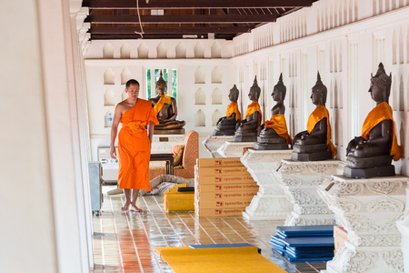Chaiyaphum, Thailand - July, 02, 2017 : The Monk and Buddha statue in Wat Phra That Chaiyaphum Temple at Chaiyaphum, Thailandのeditorial素材