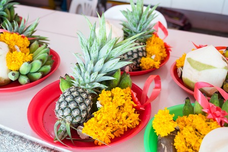 Fruits and flower at the sacrifice ceremony Ganesh god in temple Nakhon Nayok, Thailandの写真素材