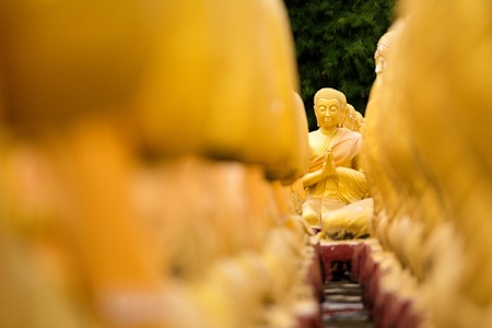 Nakhon Nayok, Thailand - July, 16, 2017 : Sculpture Figures Buddhist Monks. Budha and 1250 Monks, at Phuttha Utthayan Makha Bucha Anusorn Nakhon Nayok, Thailand.のeditorial素材