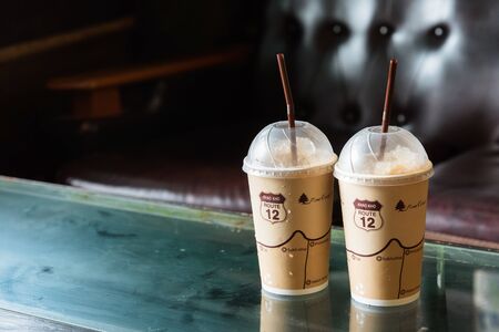 Phetchabun, Thailand - July, 15, 2017 : Two Espresso Ice coffee drink on wooden table in cafe of Route 12 coffee shop at Khao Kho Phetchabun Thailand.のeditorial素材