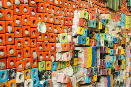Walls covered with colorful ceramic tiles in Tao Hong Tai Ceramics Factory at Ratchaburi, Thailandの写真素材
