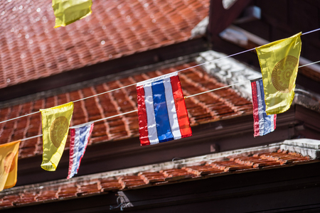 Thai flags and buddhism yellow flags in the templeの写真素材