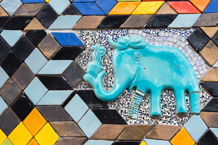Walls covered with colorful ceramic tiles in Tao Hong Tai Ceramics Factory at Ratchaburi, Thailandの写真素材