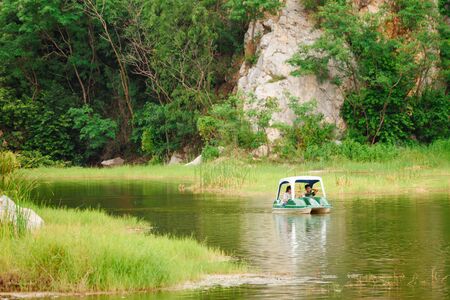 Ratchaburi, Thailand - July, 23, 2017 : Unidentified name Tourist enjoy with pedal boat on the lake of Khao Hin Ngu Rock Park at Ratchaburi, Thailandのeditorial素材