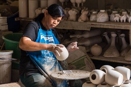 Ratchaburi, Thailand - July, 23, 2017 : Unidentified name Workers are working in a Tao Hong Tai...
