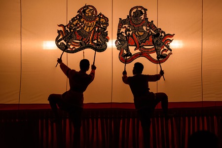 Ratchaburi, Thailand - July, 23, 2017 : Unidentified name Man showt large shadow play is performed in Wat Khanon temple at Ratchaburi, Thailandのeditorial素材