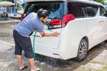 Ratchaburi, Thailand - July, 23, 2017 : Unidentified name Man cleaning his car in Wat Khanon at Ratchaburi, Thailandのeditorial素材
