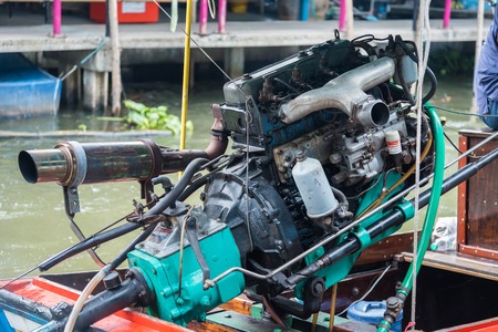 Bangkok, Thailand - July, 30, 2017 : Rear side of long tail boat with dirty old engine at Khlong Lat Mayom Floating Market Bangkok, Thailand.のeditorial素材