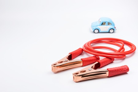 Nonthaburi, Thailand - September, 08, 2017 : Volkswagen Toy car and  jumper cables for car battery on white background, Nonthaburi, Thailandのeditorial素材