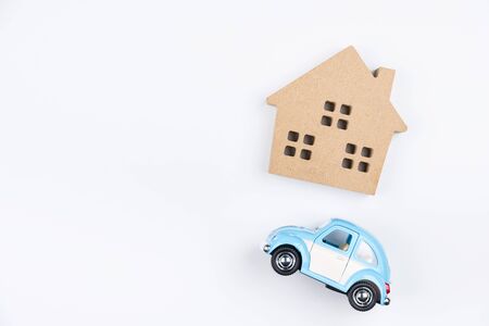 Nonthaburi, Thailand - September, 08, 2017 : Volkswagen Toy car and wooden house on a white background.Business concept.Real estate concept Nonthaburi, Thailandのeditorial素材