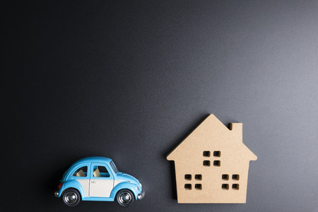 Nonthaburi, Thailand - September, 08, 2017 : Volkswagen Toy car and wooden house on a black background.Business concept.Real estate concept Nonthaburi, Thailandのeditorial素材