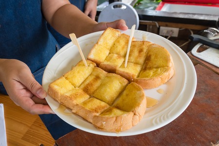 Bread toast with butter and sugar deliciousの写真素材