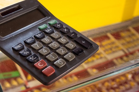 Calculator on glass cabinetの写真素材