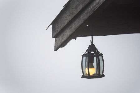Lamp hanging on the roof of the house