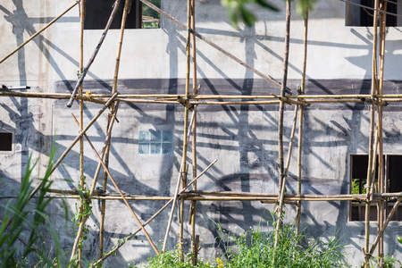 Home construction traditional bamboo scaffolding in thailandの写真素材