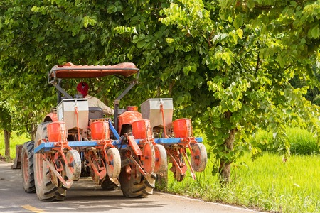 Nan, Thailand - September, 24, 2017 : Unidentified name Farmer driving a tractor on the road...