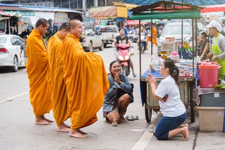 Nan, Thailand - September, 23, 2017 : Unidentified name buddhist monk alms offering food in the morning market at Nan Province, Thailandのeditorial素材