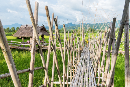 Nan, Thailand - September, 24, 2017 : Bamboo bridge in paddy field at Tai Lue Coffee Shop in Nan Province, ThailandThailandのeditorial素材