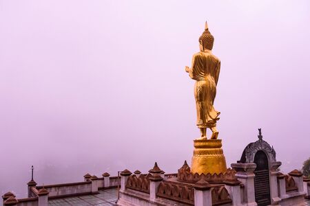 Nan, Thailand - September, 23, 2017 : Buddha standing on a mountain at Wat Phra That Khao Noi in Nan Province, Thailandのeditorial素材