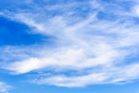 White textured clouds in the blue sky