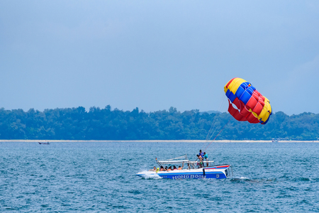 Rayong, Thailand - October, 07, 2017 : Unidentified name tourist sea parasailing water.Flying on a parachute behind a boat on a summer holiday by the sea in Rayong, Thailandのeditorial素材