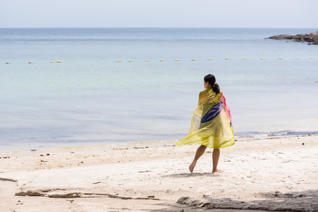 Rayong, Thailand - October, 07, 2017 : Unidentified name Woman walking on the beach in the daytime at the Koh Samet island, Rayong, Thailandのeditorial素材