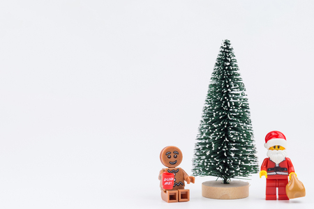 Nonthaburi, Thailand - November, 14, 2017 : Lego Santa and christmas trees isolated on white background at Christmas day.Theme Christmas day background.のeditorial素材