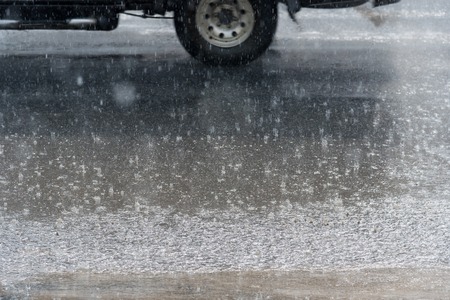 Heavy rain on the city street.Thailandの写真素材