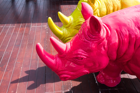 Statue green and red rhino are used for decoration.Thailandの写真素材
