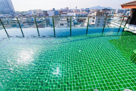 Prachuab Khirikhan, Thailand - November, 26, 2017 : Swimming pool on the rooftop building with city and sky background at Hua Hin city Prachuab Khirikhan, Thailandのeditorial素材