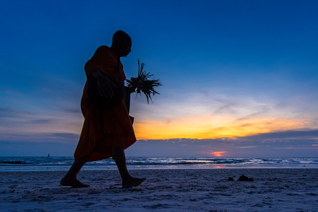 Prachuab Khirikhan, Thailand - November, 26, 2017 : Unidentified name buddhist monk was walking alms offering food in the morning on the beach at Hua Hin Beach Prachuab Khirikhan, Thailand.のeditorial素材