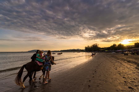 Prachuab Khirikhan, Thailand - November, 25, 2017 : Unidentified name children a horse at Khao Takiab beach of Thailand.のeditorial素材