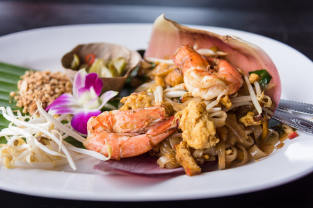 Thai Noodle Pad Thai with shrimp and vegetables on a wooden background.Thailandの写真素材