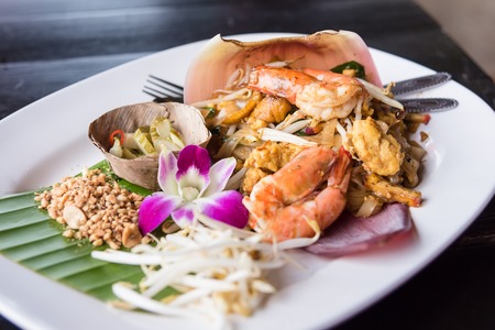Thai Noodle Pad Thai with shrimp and vegetables on a wooden background.Thailandの写真素材