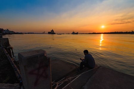 Samut Prakan, Thailand - December, 24, 2017 : Unidentified name People come to watch sunset in the evening at Samut Prakan, Thailand.のeditorial素材