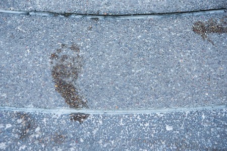 Footprints are wet on cement floorの写真素材