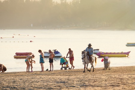 Prachuab Khirikhan, Thailand - December, 23, 2017 : Unidentified name people riding a horse at Khao Takiab beach of Thailand.のeditorial素材