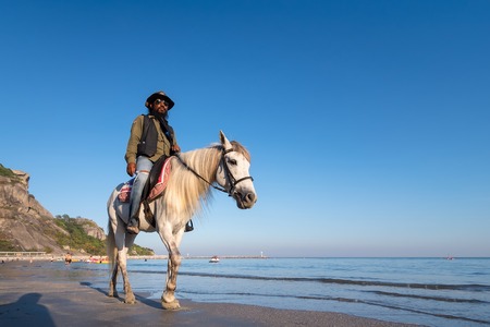 Prachuab Khirikhan, Thailand - December, 23, 2017 : Unidentified name people riding a horse at Khao Takiab beach of Thailand.のeditorial素材